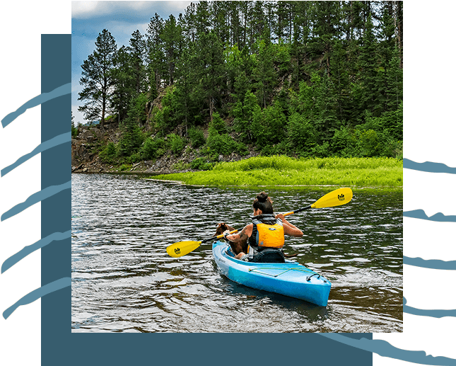 A woman kayaking in a river.