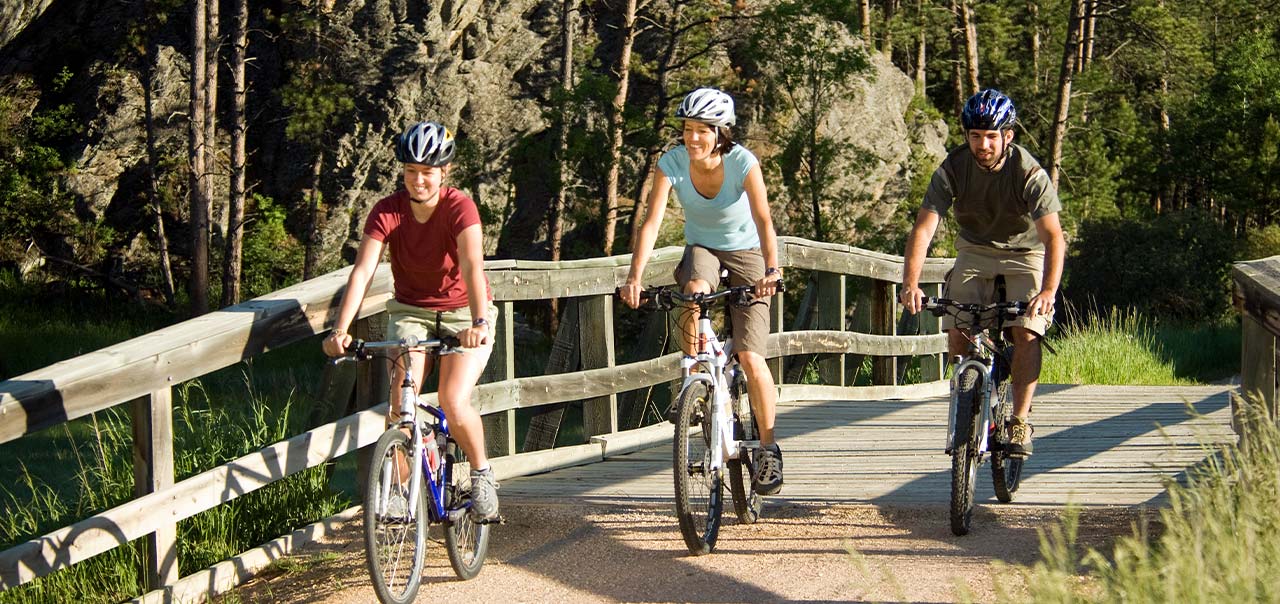 A group of people biking. 