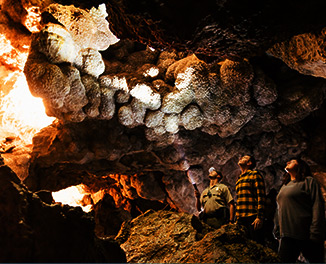 A tour group exploring a beautiful underground cave. 